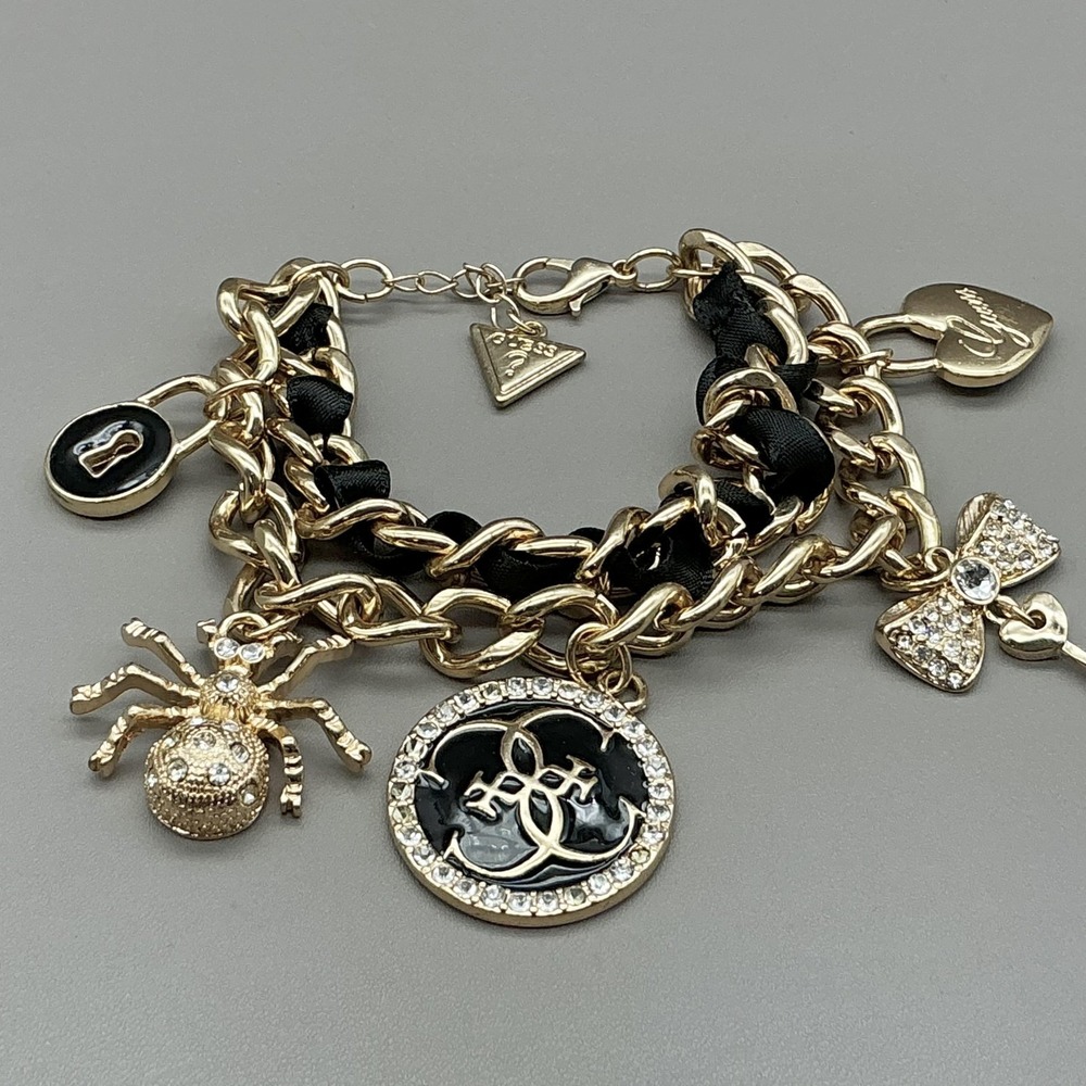 Guess Bracelet Gold Tone Black Enamel Crystal Spider Logo Charm‎ Womens Fashion - Picture 2 of 8